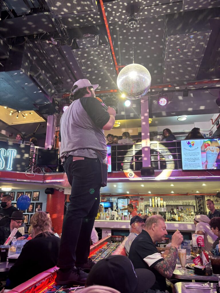 Singers on a table at Stardust Diner