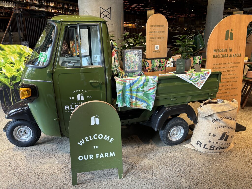 A green tiny truck with Hacienda Alsace written on it at Starbucks Reserve Roastery