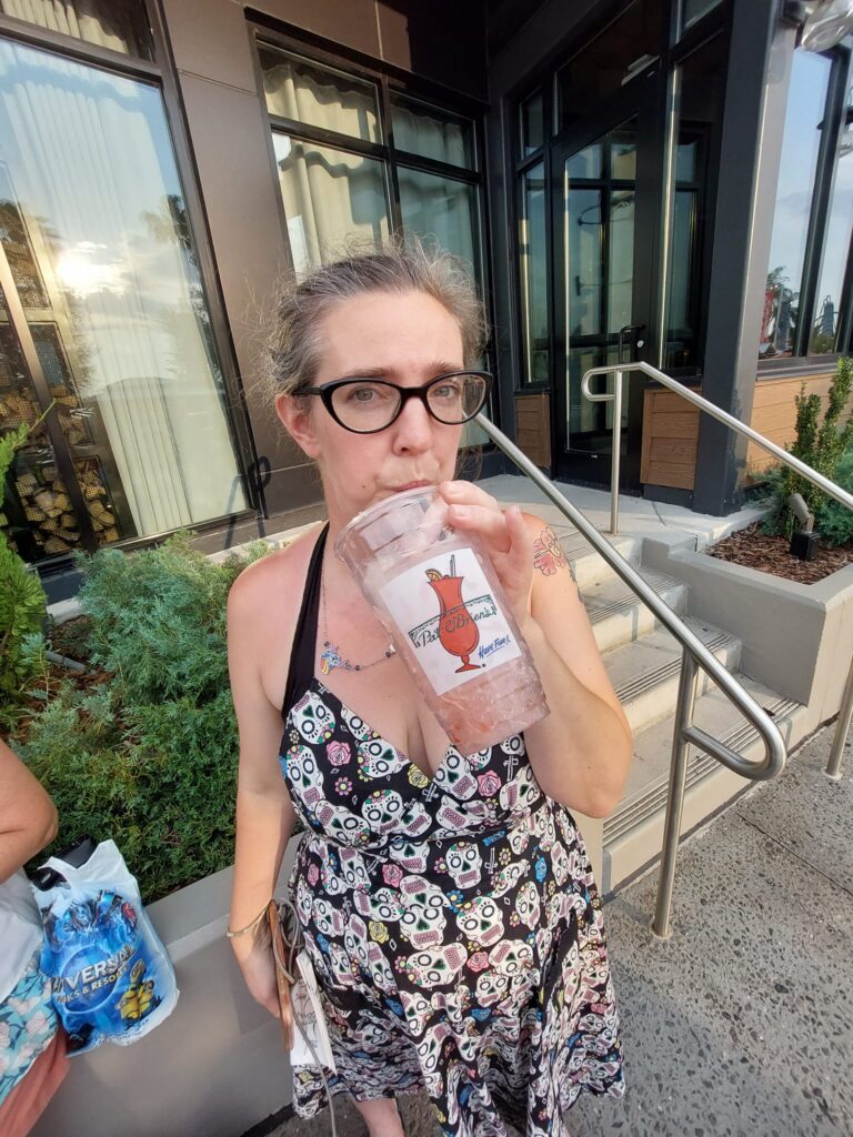 A female drinking from a Pat O'Brien's cup