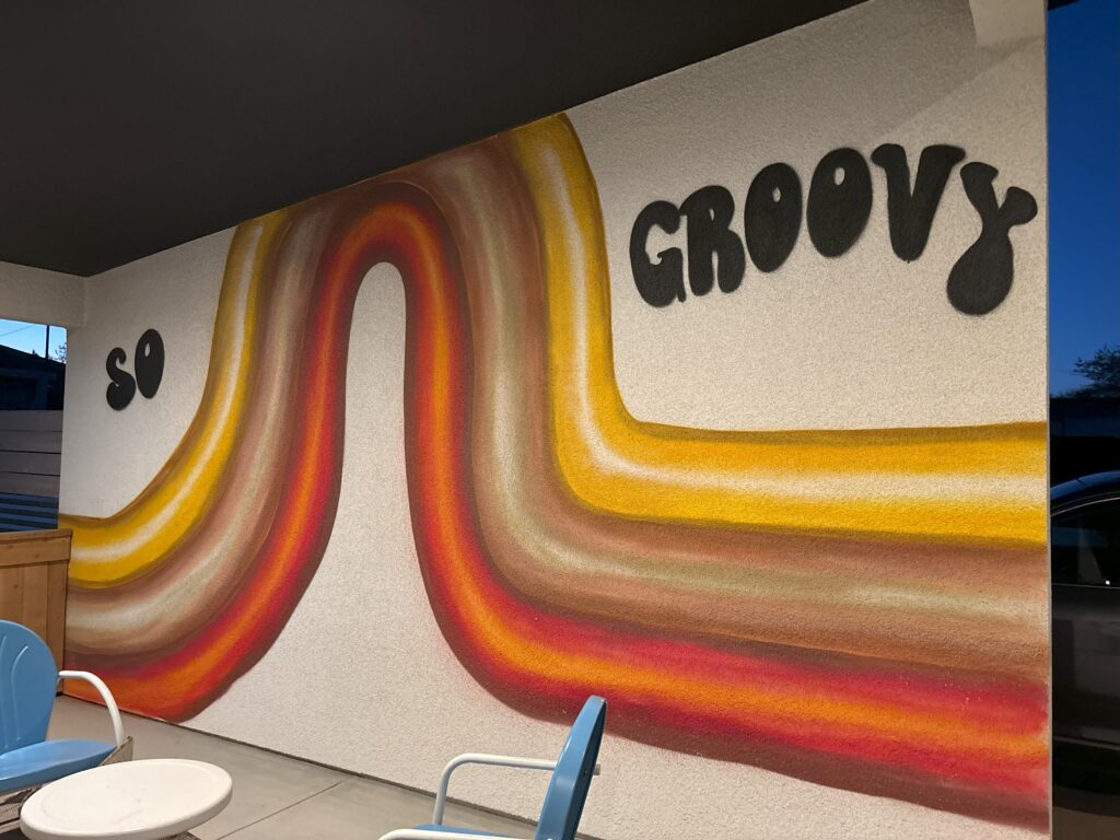 A wall with "So Groovy" written on it