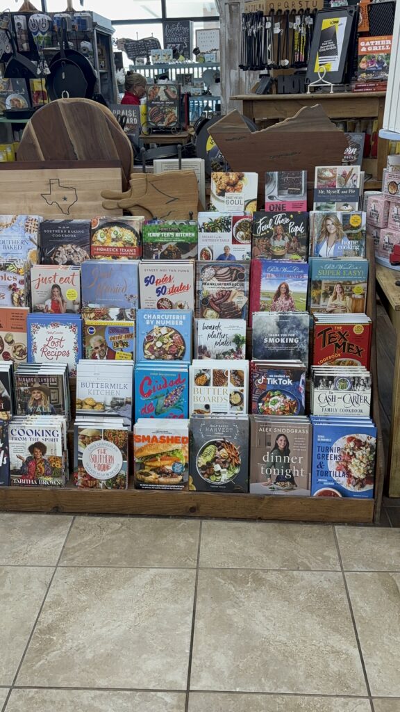 A book shelf with cookbooks on them