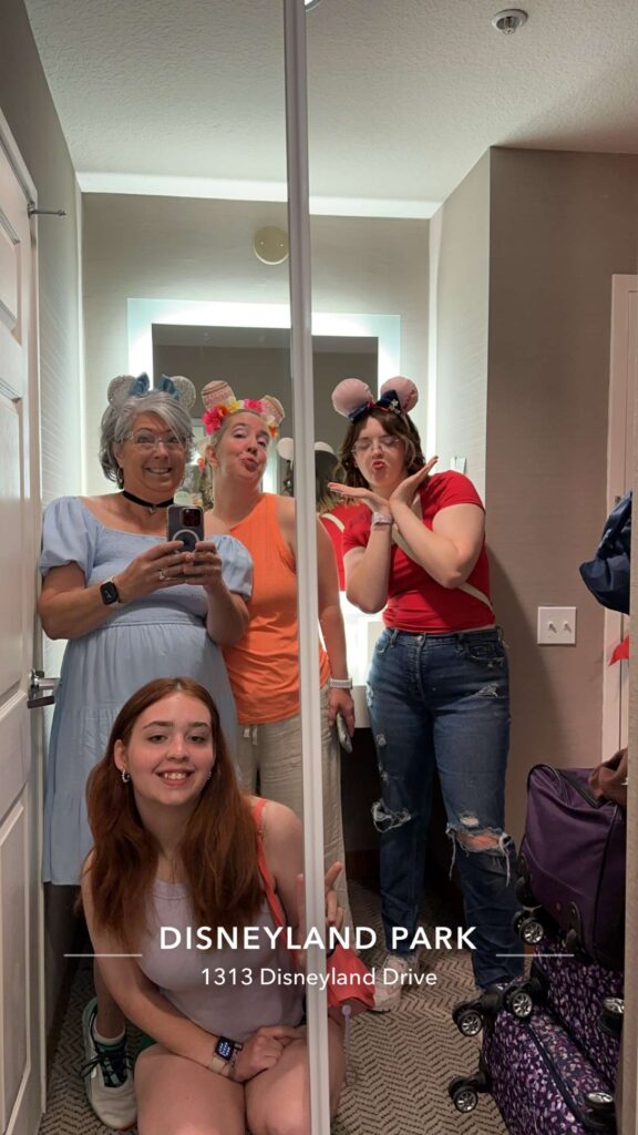 Four women dressed as Disney Princesses