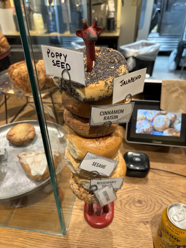 A pile of bagels on a stick at Pavement Coffee in Boston