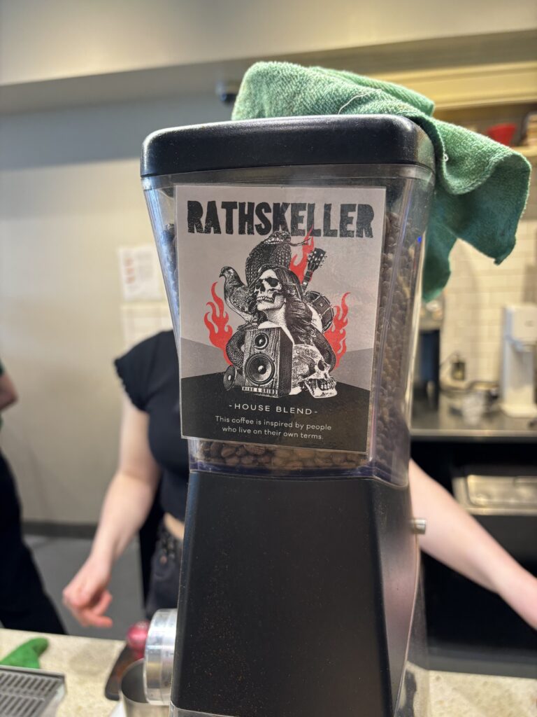 A coffee grinder with a skull on it