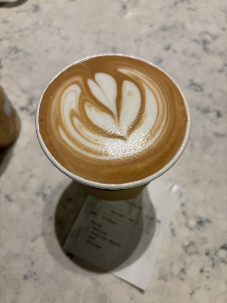 A mocha with a rosette latte art design