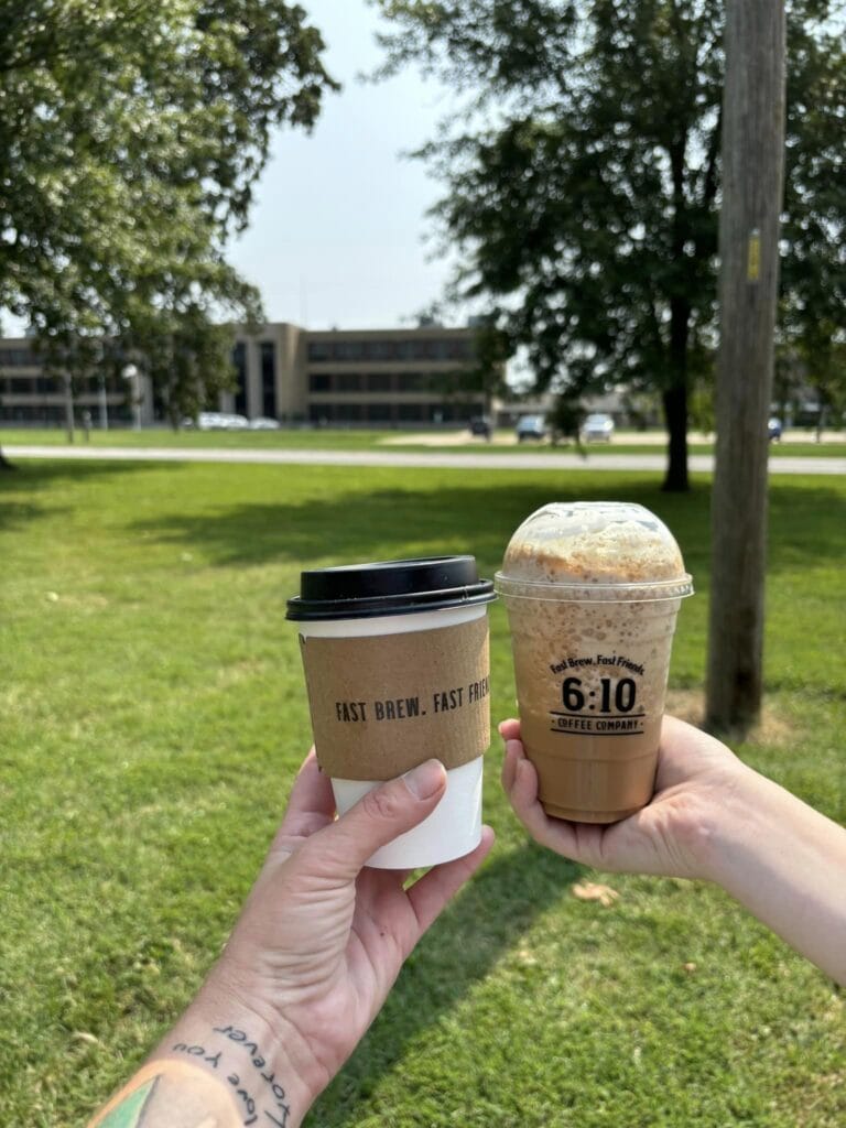 Two cups of coffee in front of Salem Community High School