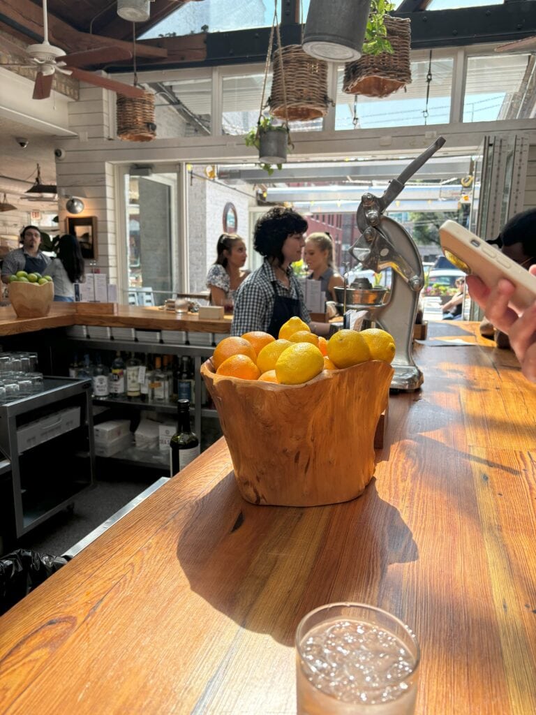 The inside of a restaurant that has natural sunlight