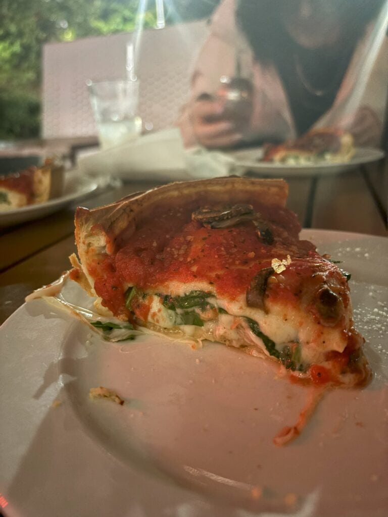 A slice of deep dish pizza