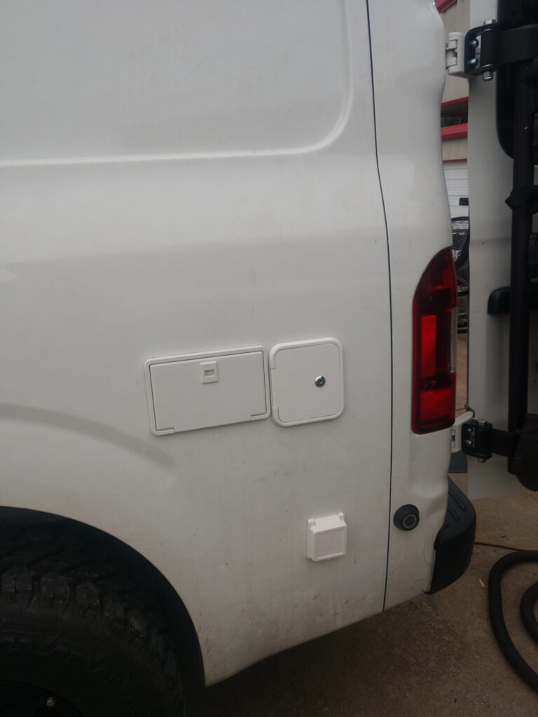 The water system on the outside of a van