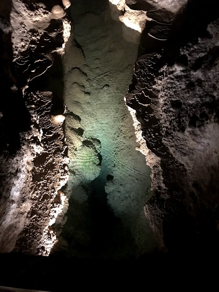 A pool of water inside the big room at Carlsbad Caverns