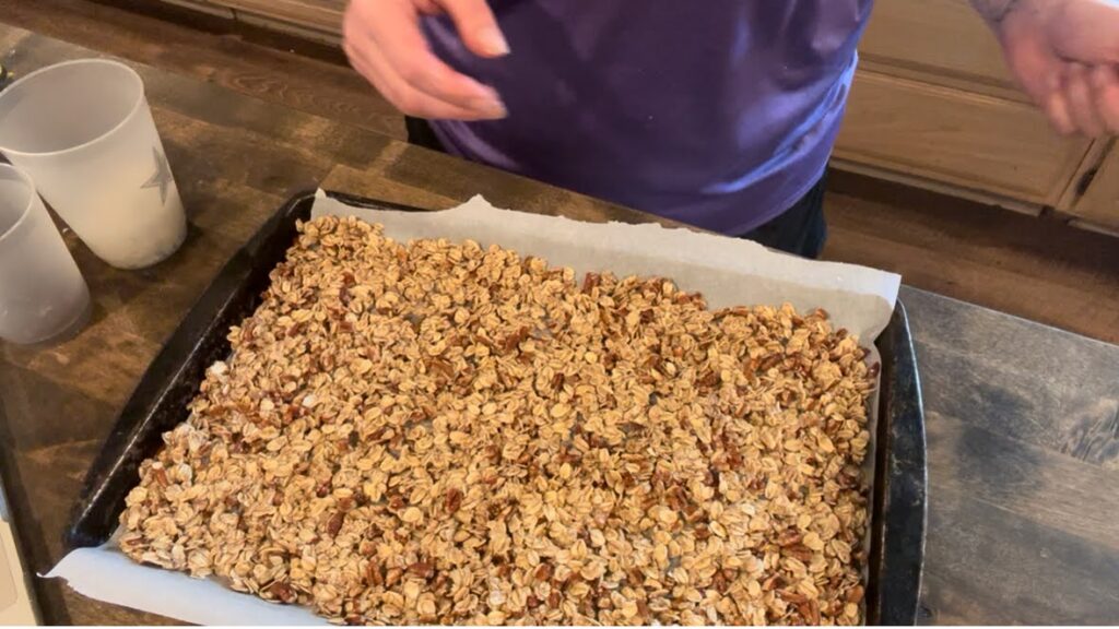 Unbaked granola on cookie sheet