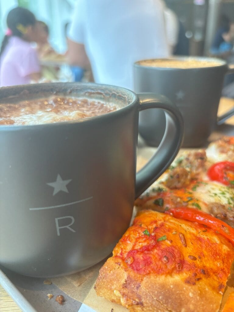 Two Starbucks drinks with pizza