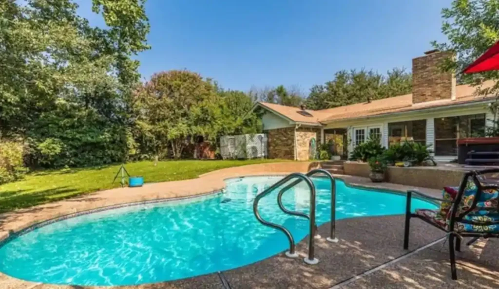 An inground pool in someone's backyard