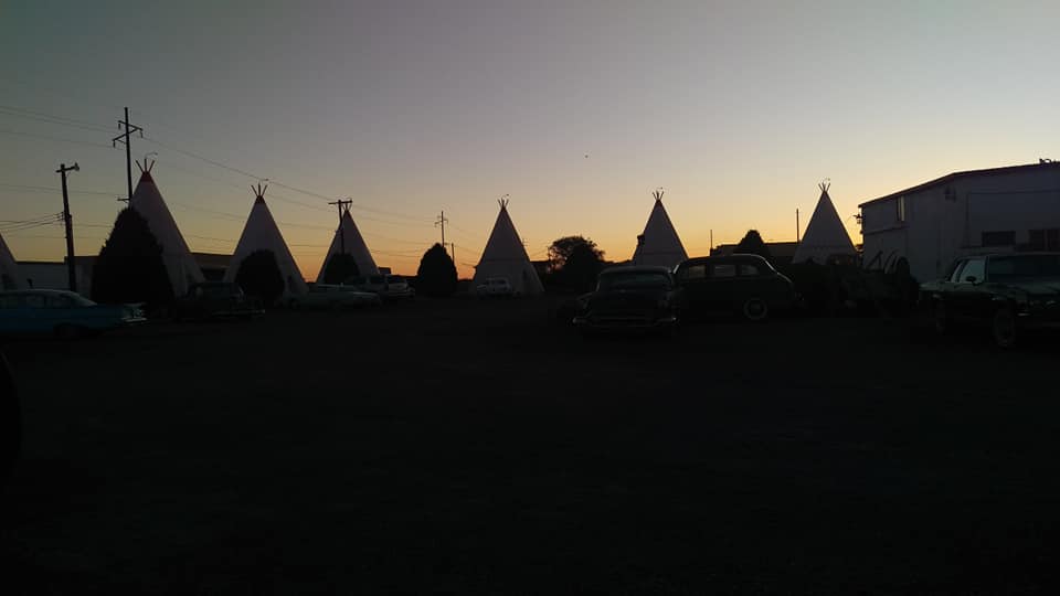 A darkened picture of the sunset over the wigwam motel in Holbrook, Arizona