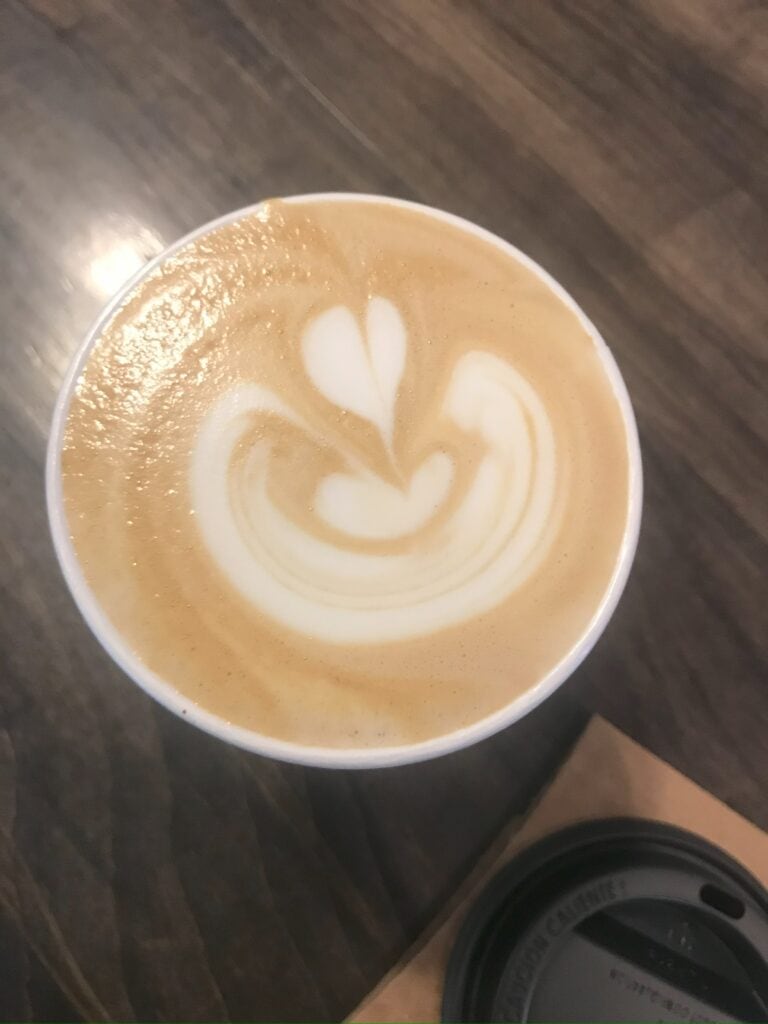 A light latte with coffee a three layer heart inside