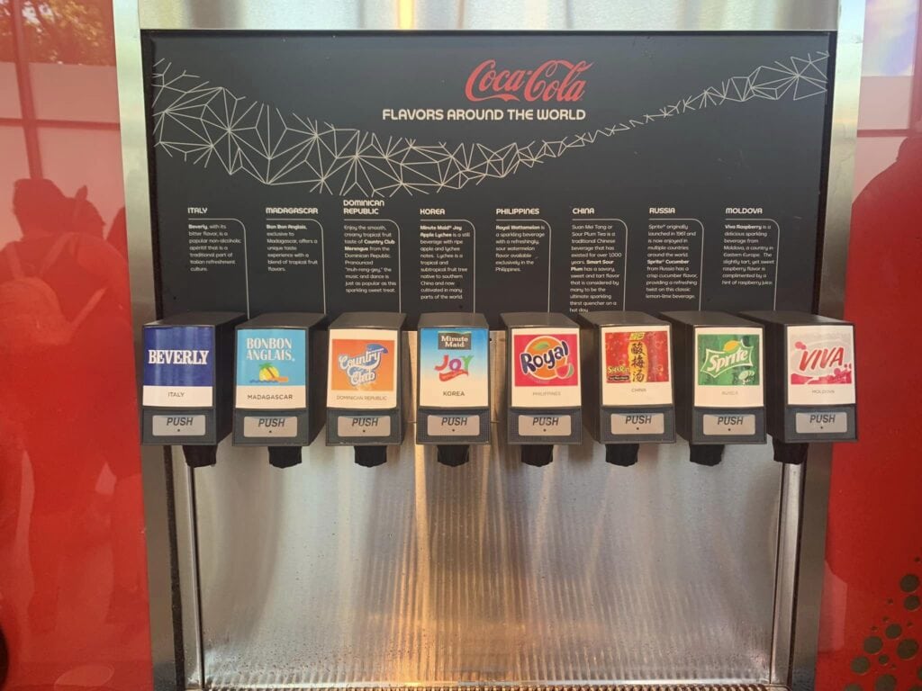 A soda machine with coca-colas from all over the world