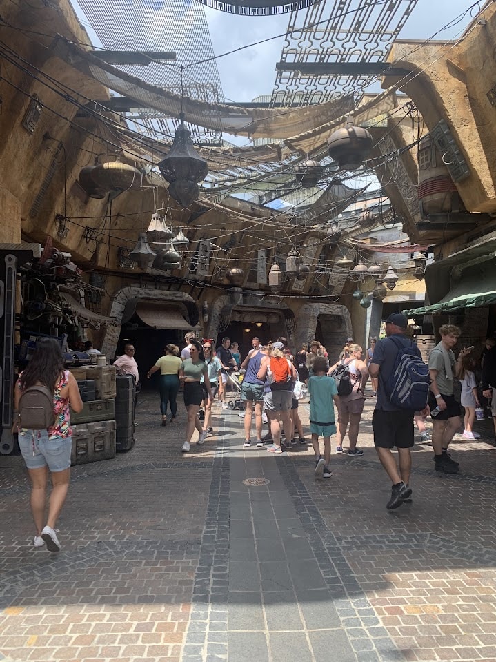 Galaxy's Edge with a funky ceiling and people walking around