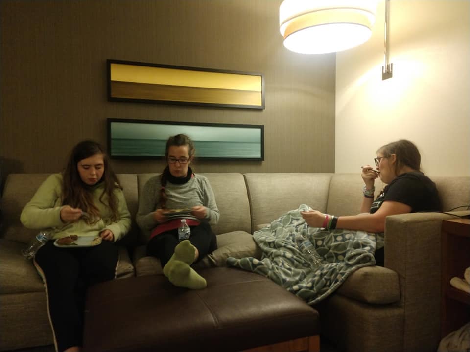 Three girls eating dinner at a hotel