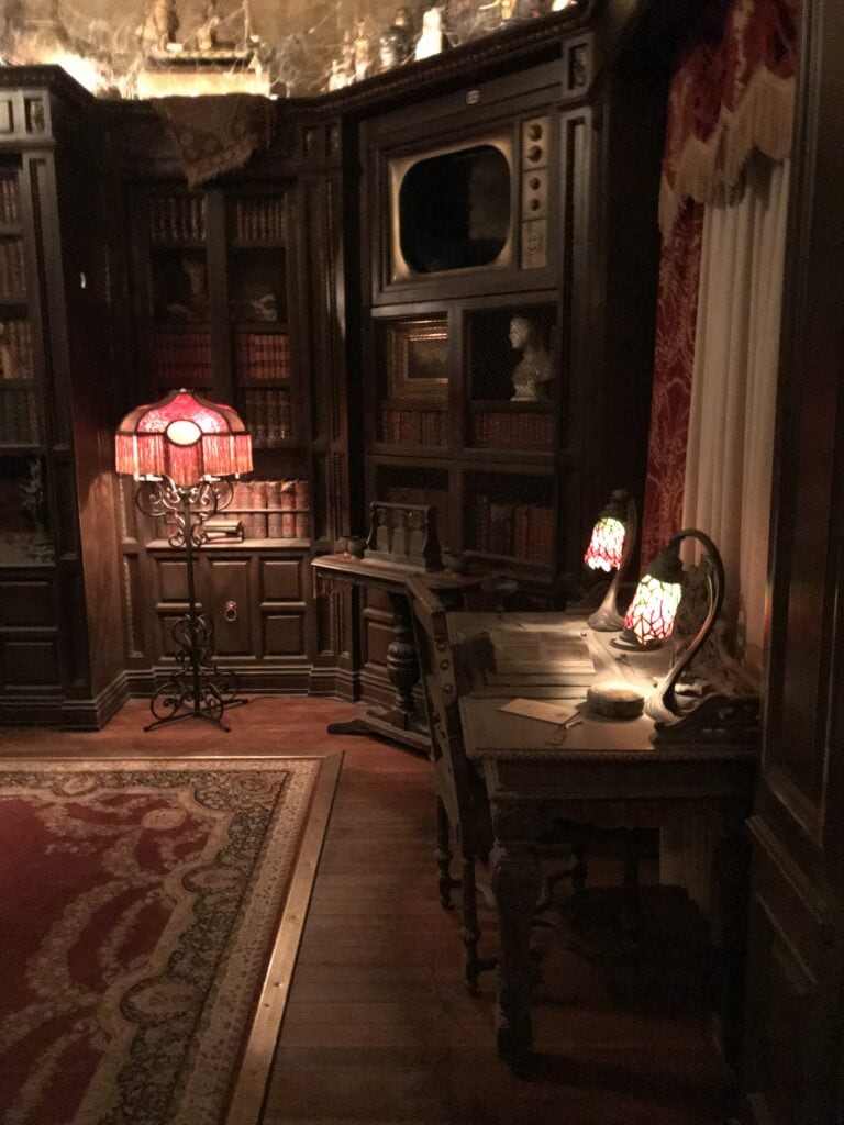 The inside of an old looking building with a red lamp