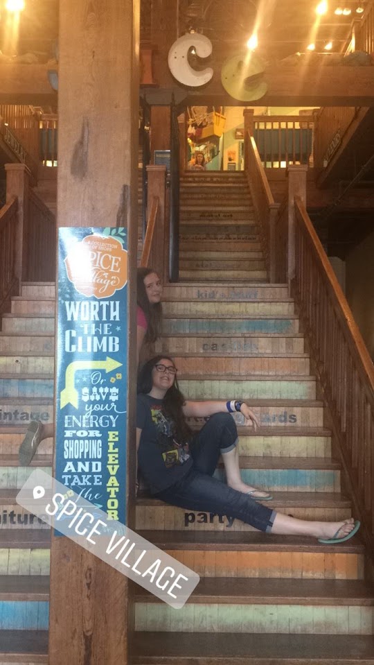 Two girls on the stairs at spice village. Its one of the best free things to do in Waco