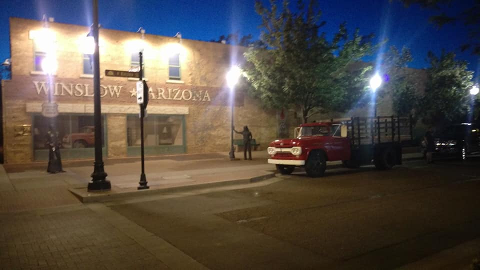 A building in Winslow, Arizona with a flat bed Ford