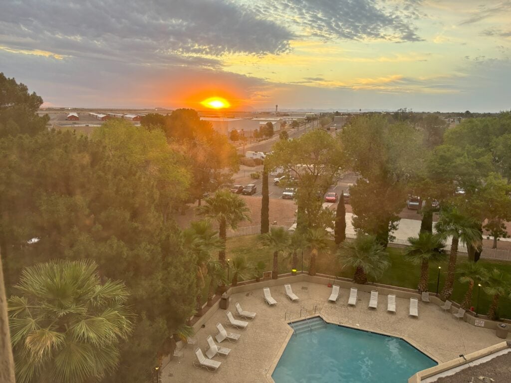 The sunrise as seen from our hotel room, over looking the pool and the city