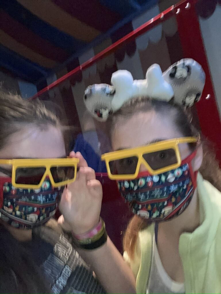 Two girls with yellow 3-D glasses on 