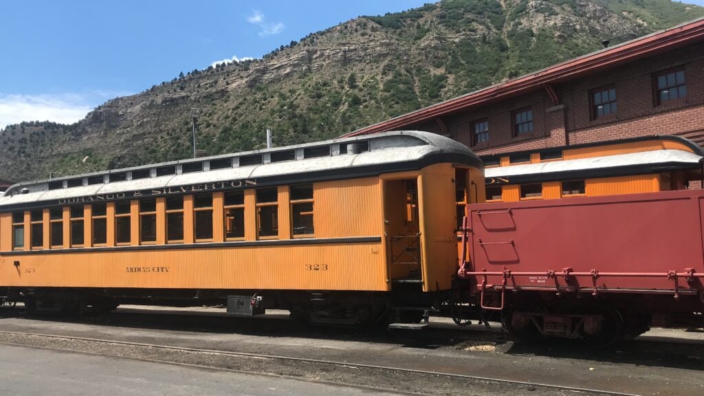 A yellow and red train at the Durango-Silverton Narrow Guage Railroad Museum's Yard Tour