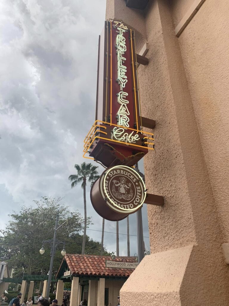 The outside of Starbucks in Hollywood Studios with a retro sign