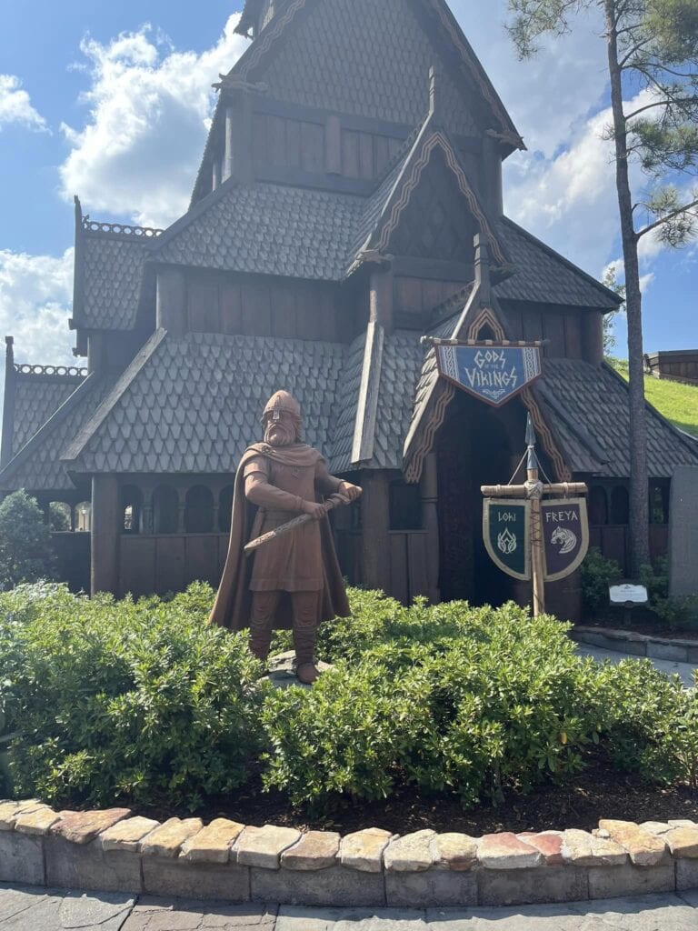 A viking statue standing in front of a house