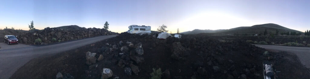 A long picture of lava and an RV at the campground in Craters of the Moon National Monument